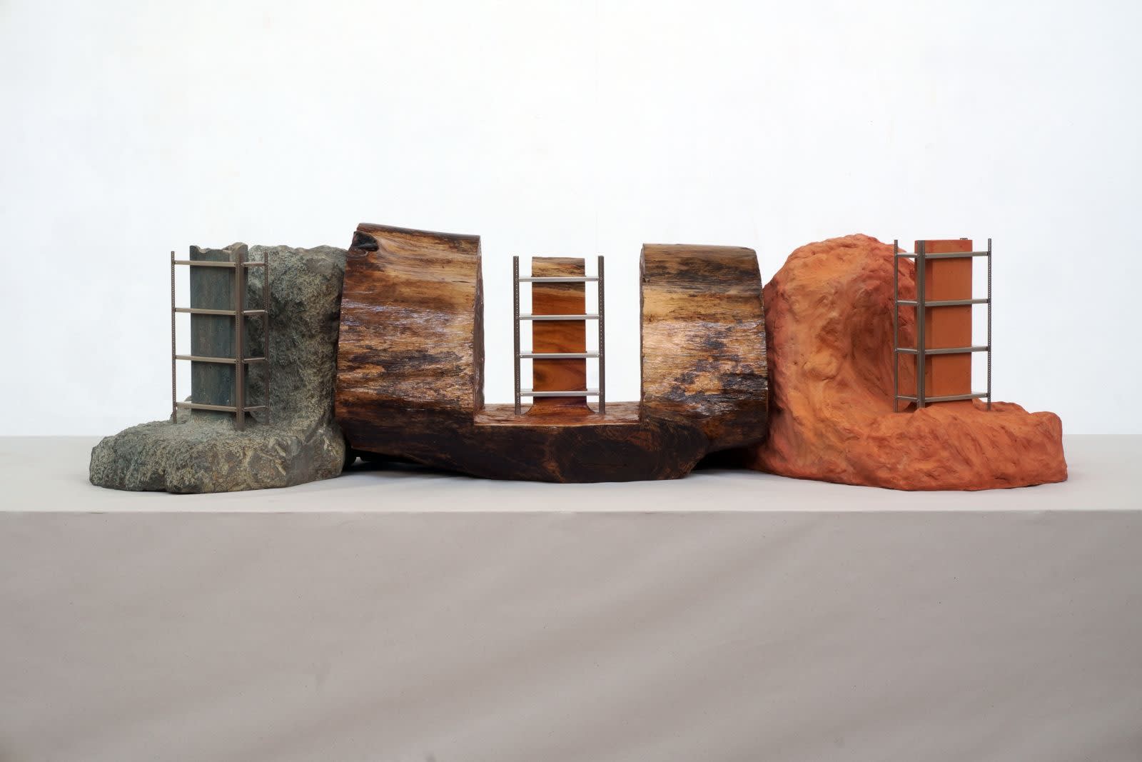 N.S. Harsha Avatar of the Origin, 2025 Stainless steel, stone, wood and terracotta 14 x 53.5 x 22.5 in