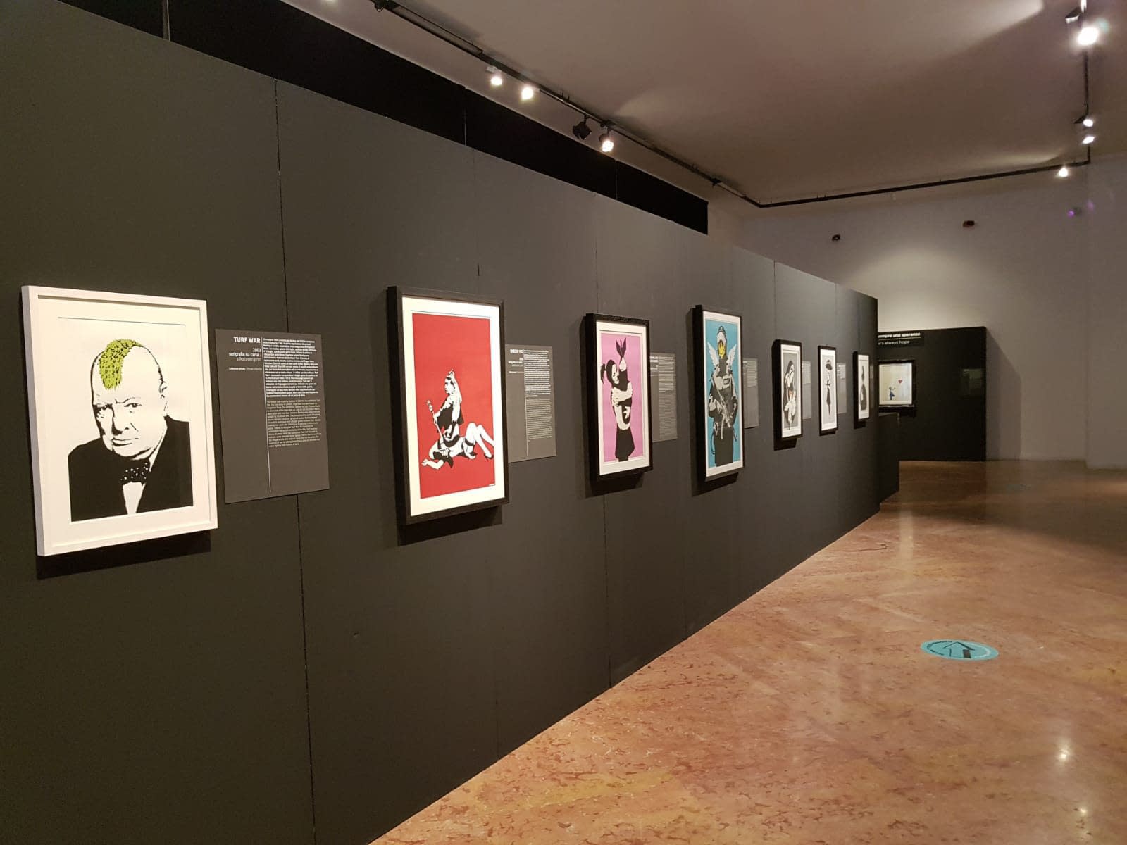 Banksy artworks hanging on wall