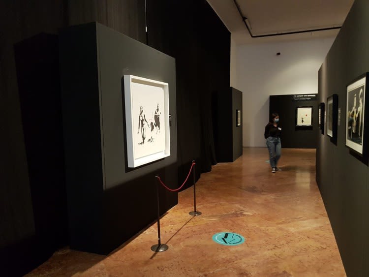 Banksy artworks hanging on wall