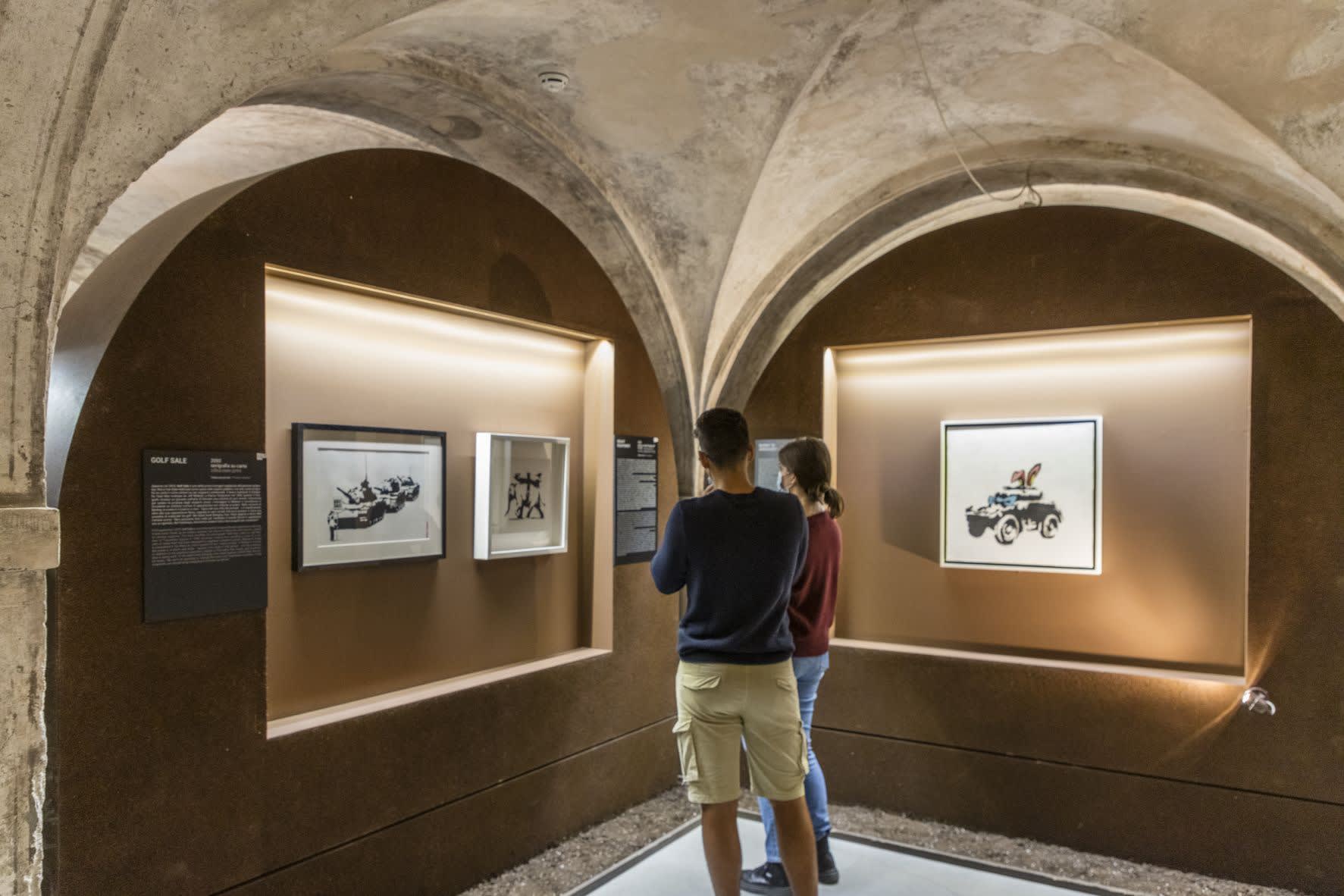 Banksy artworks hanging on wall
