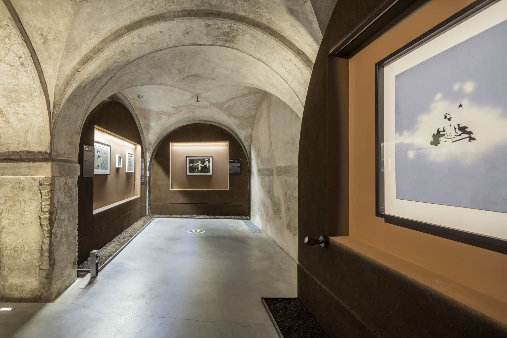 Banksy artworks hanging on wall