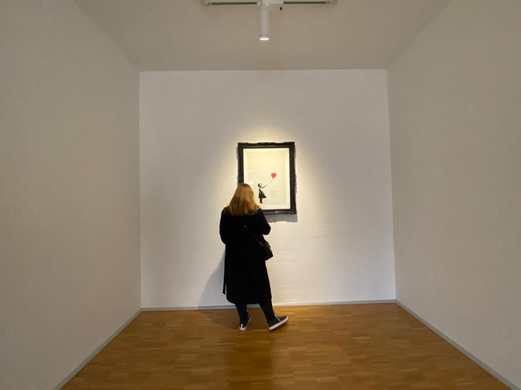 Banksy artworks hanging on wall