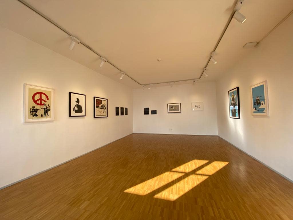 Banksy artworks hanging on wall