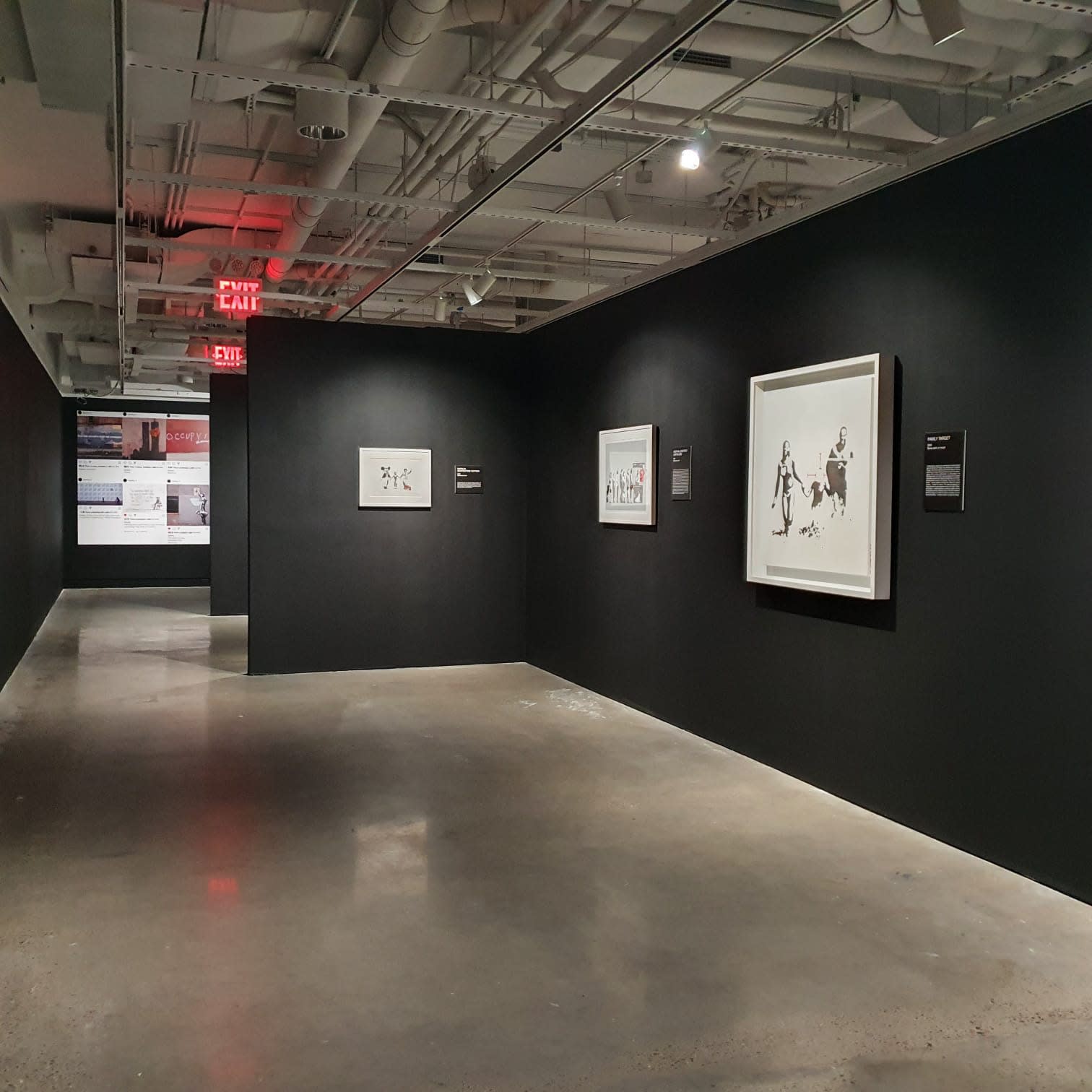 Banksy artworks hanging on wall