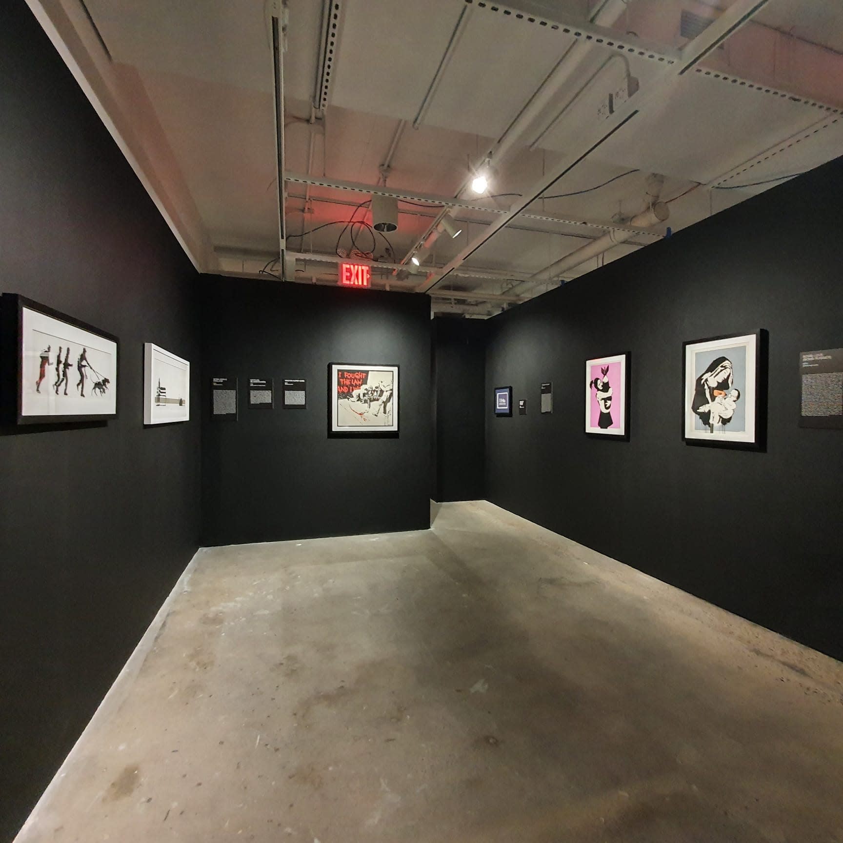 Banksy artworks hanging on wall