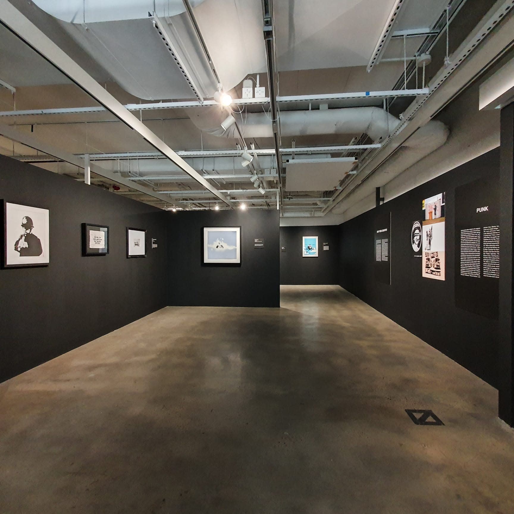 Banksy artworks hanging on wall