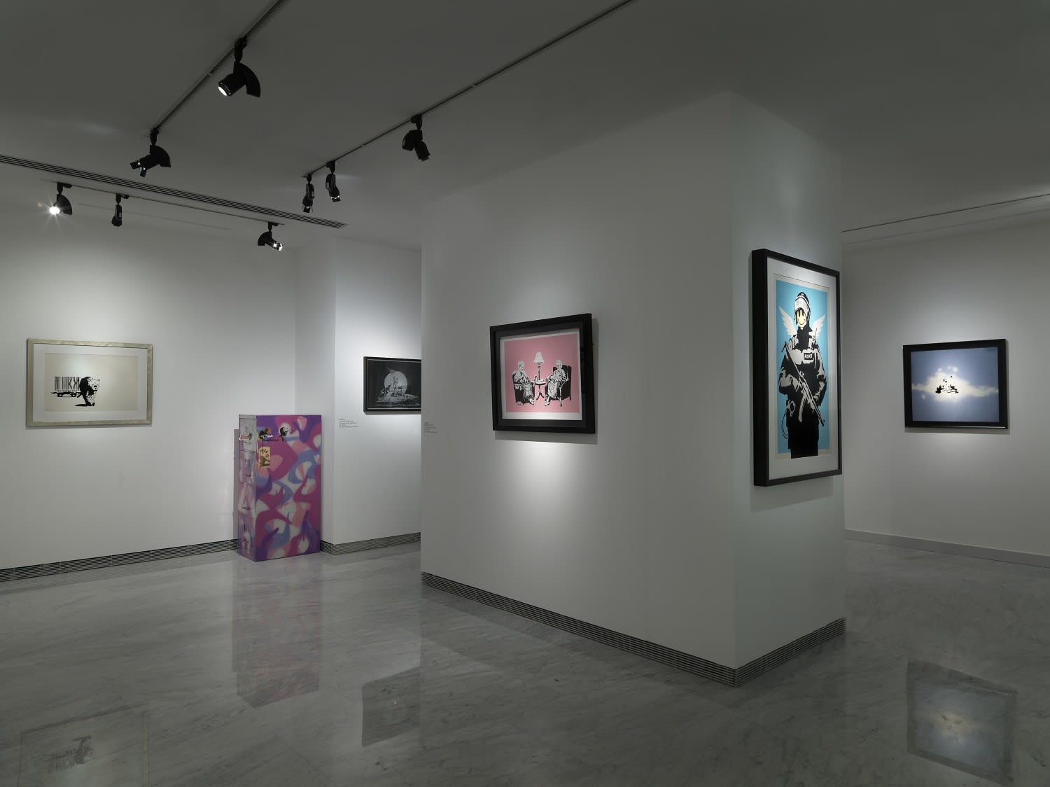 Banksy artworks hanging on wall