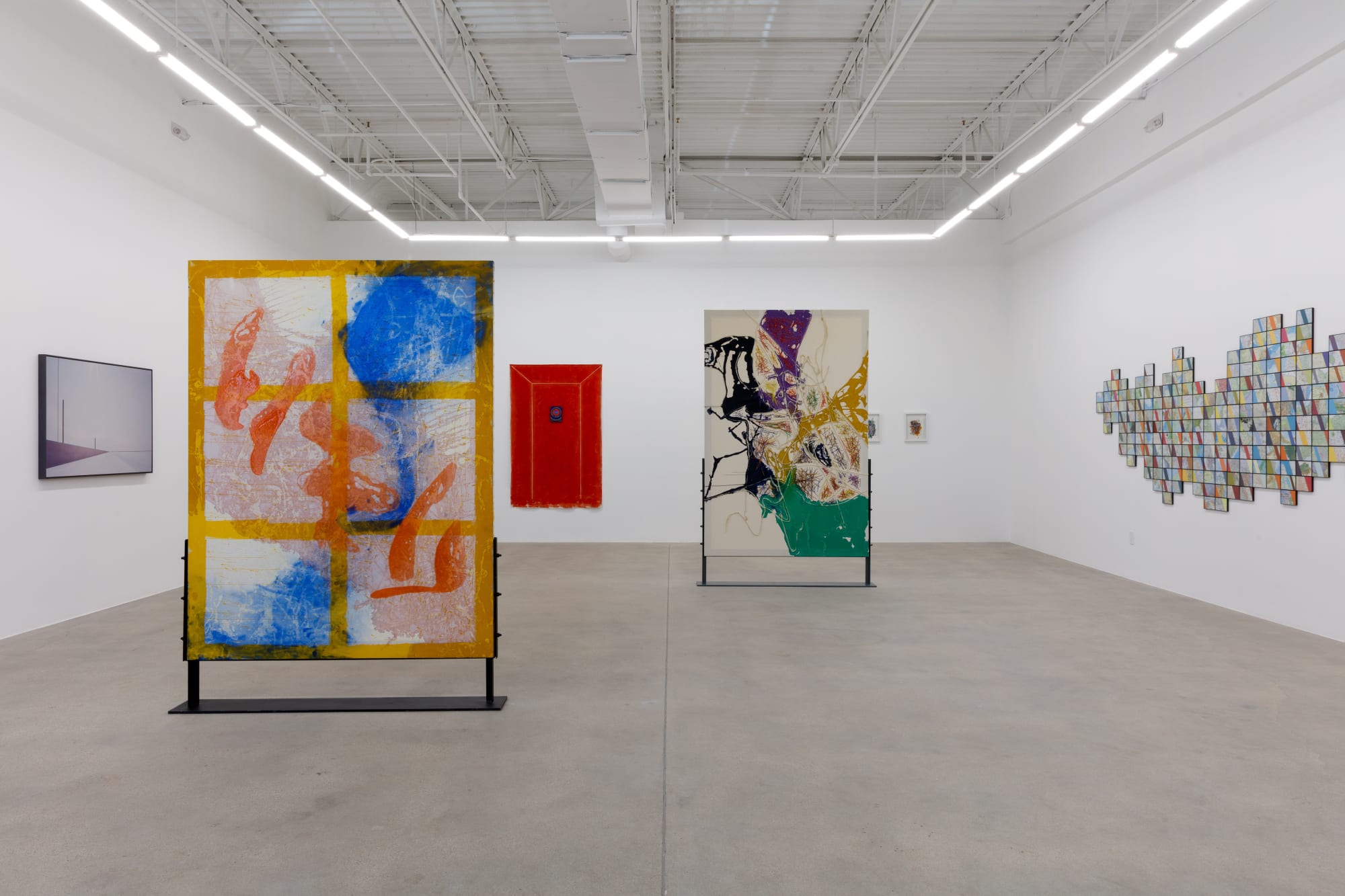installation view of How Far is In-Between, featuring paintings and drawings