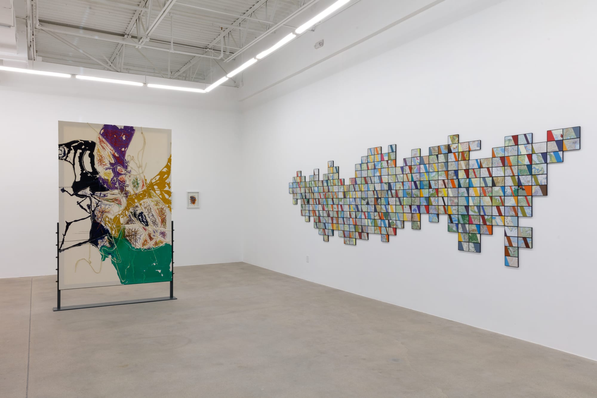 installation view of How Far is In-Between, featuring paintings and drawings