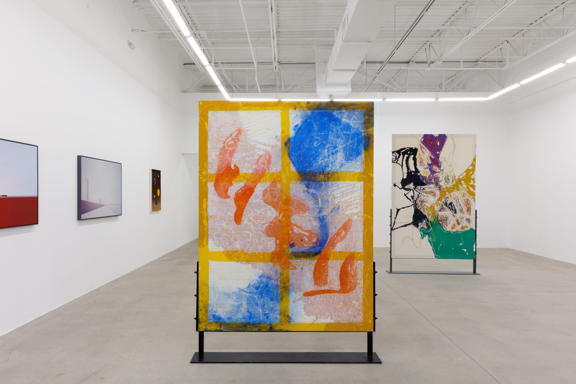 installation view of How Far is In-Between, featuring paintings and drawings