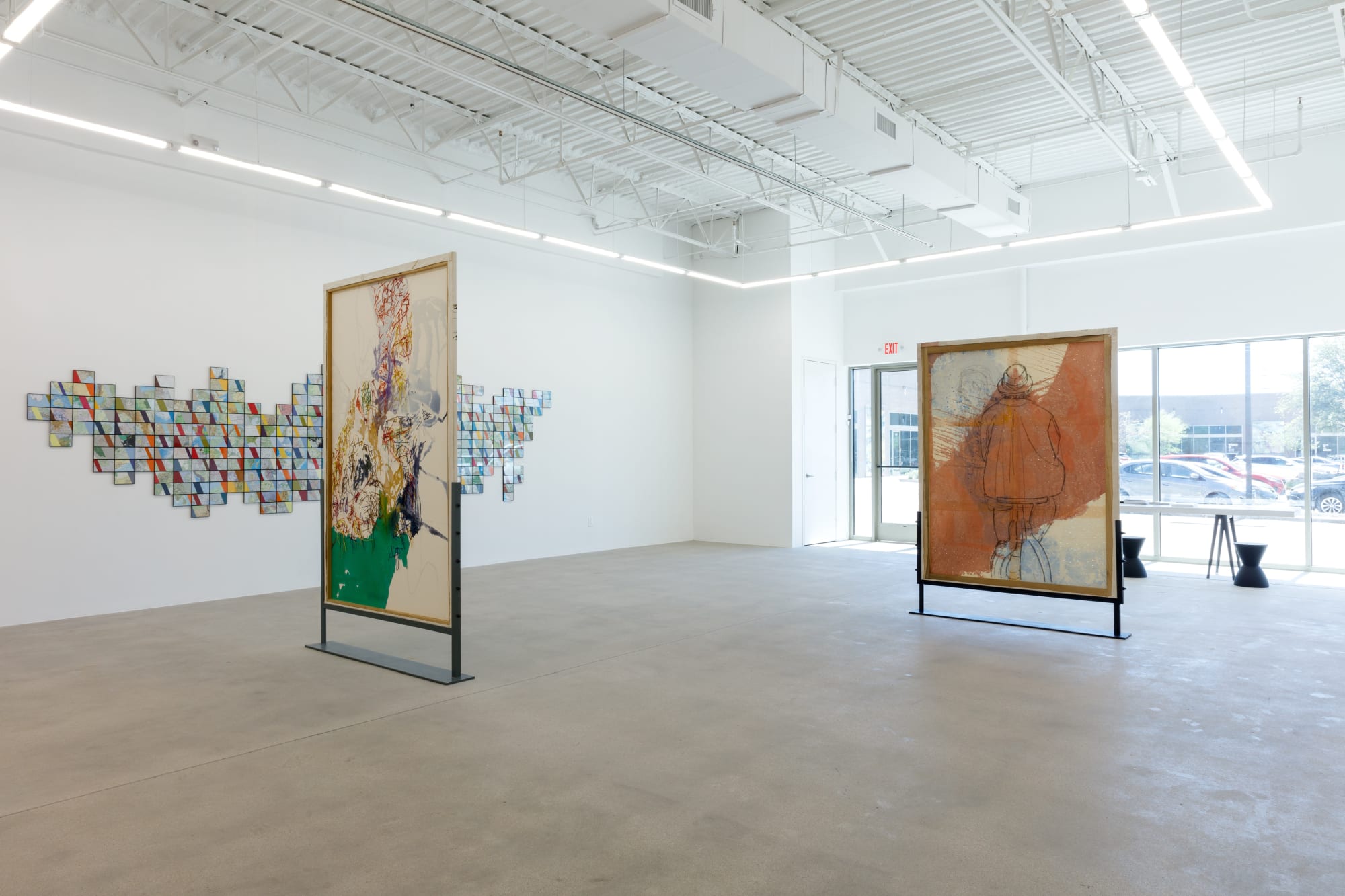 installation view of How Far is In-Between, featuring paintings and drawings