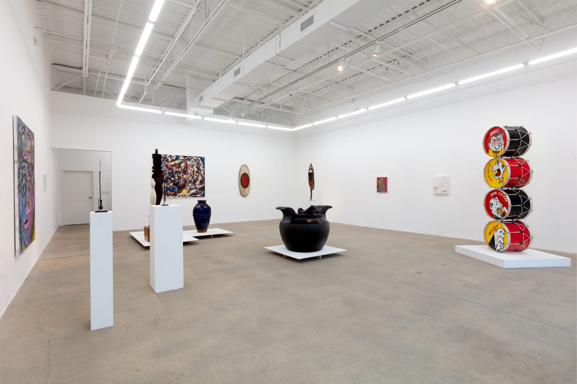 installation view of A Path Less Traveled, featuring historical ethnographic work and contemporary art