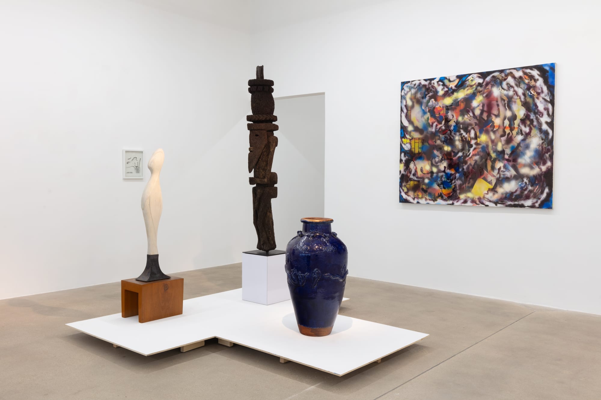 installation view of A Path Less Traveled, featuring historical ethnographic work and contemporary art