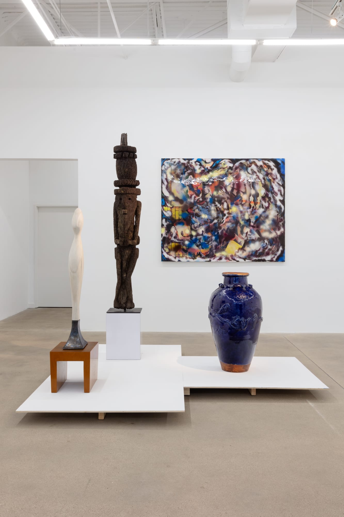 installation view of A Path Less Traveled, featuring historical ethnographic work and contemporary art