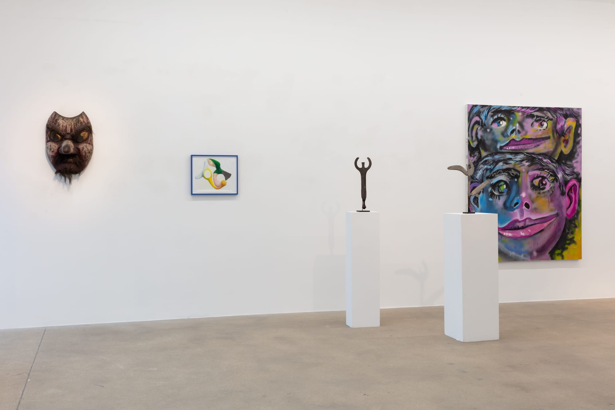 installation view of A Path Less Traveled, featuring historical ethnographic work and contemporary art