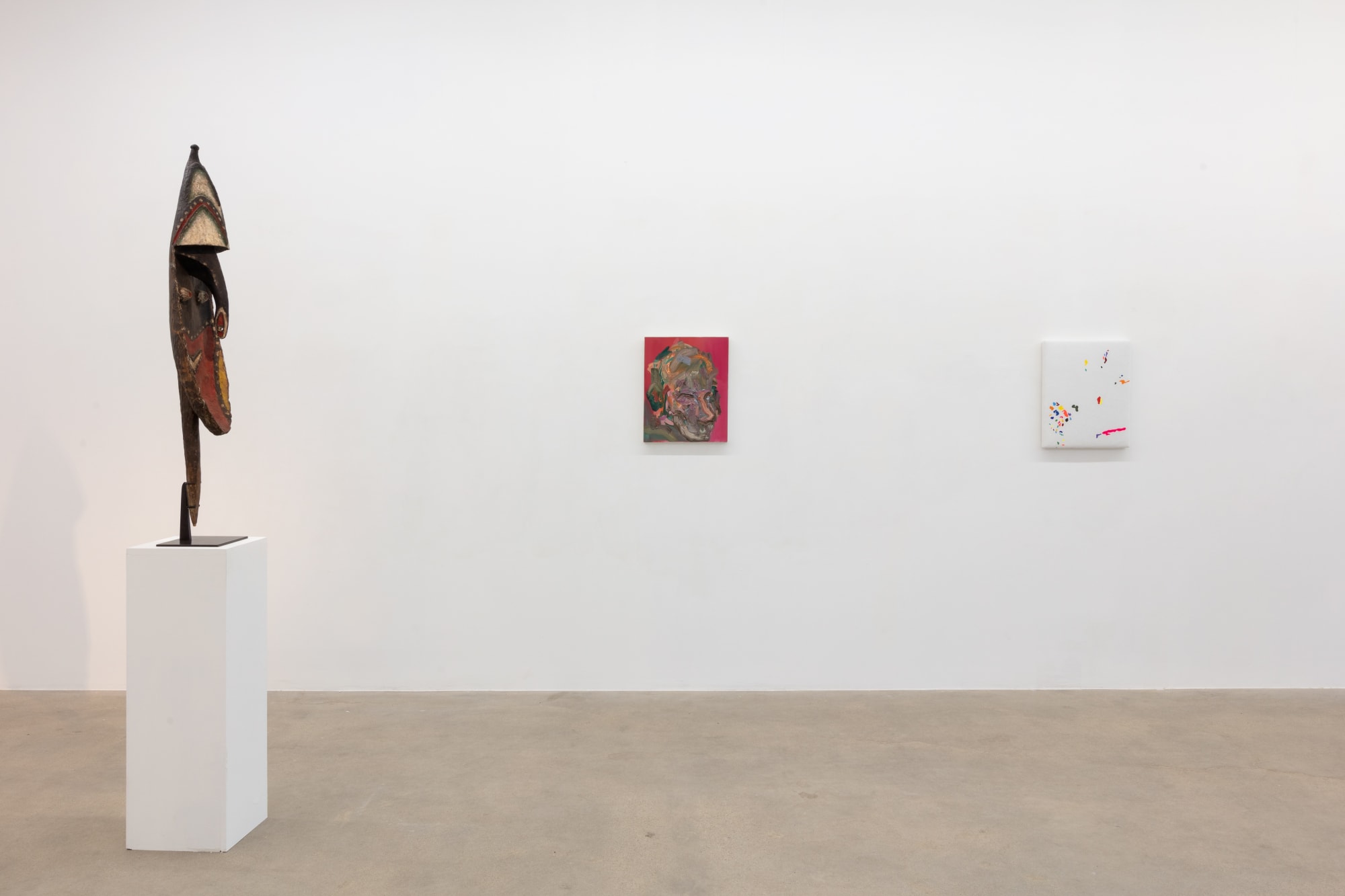 installation view of A Path Less Traveled, featuring historical ethnographic work and contemporary art