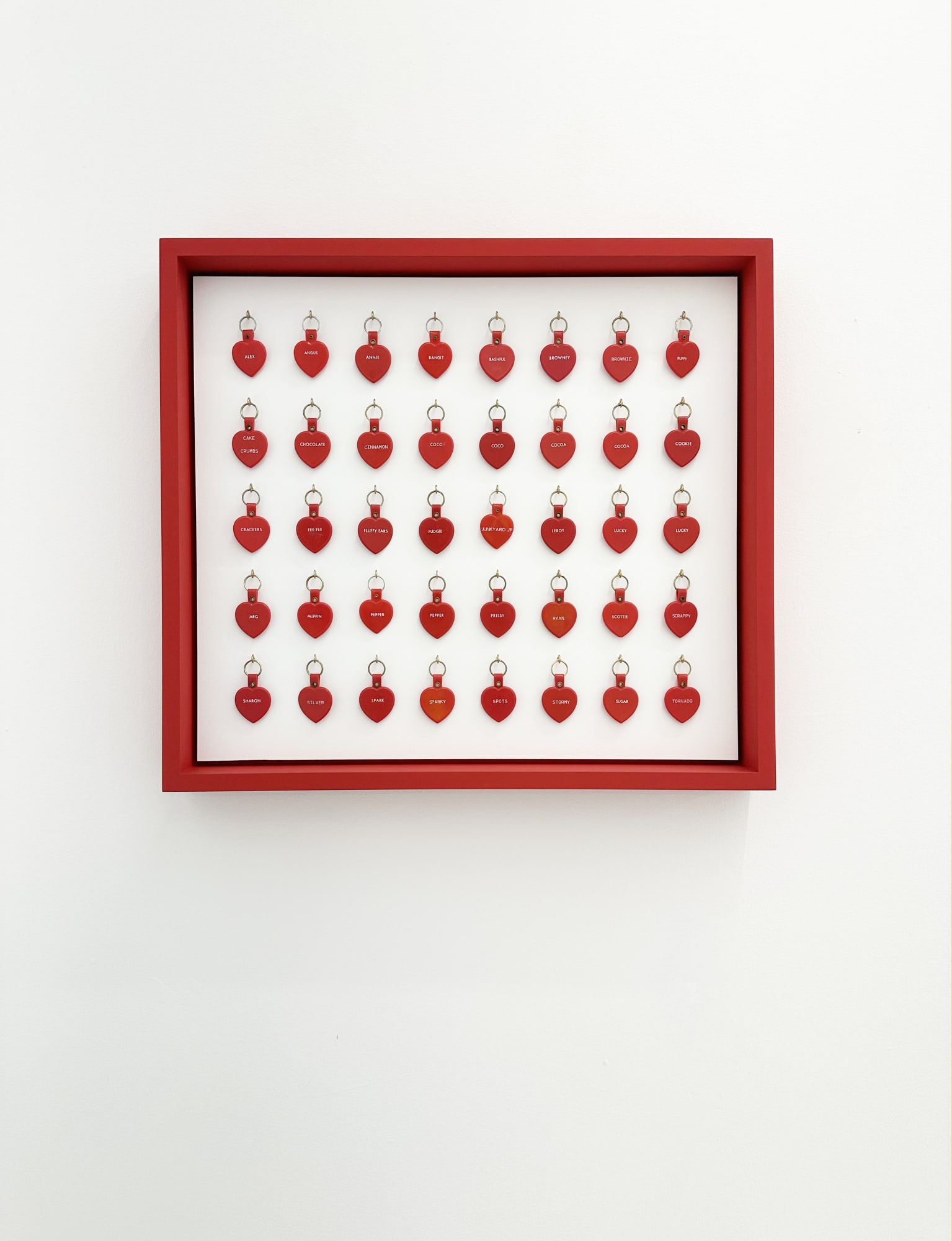 a collection of heart tags organized on board