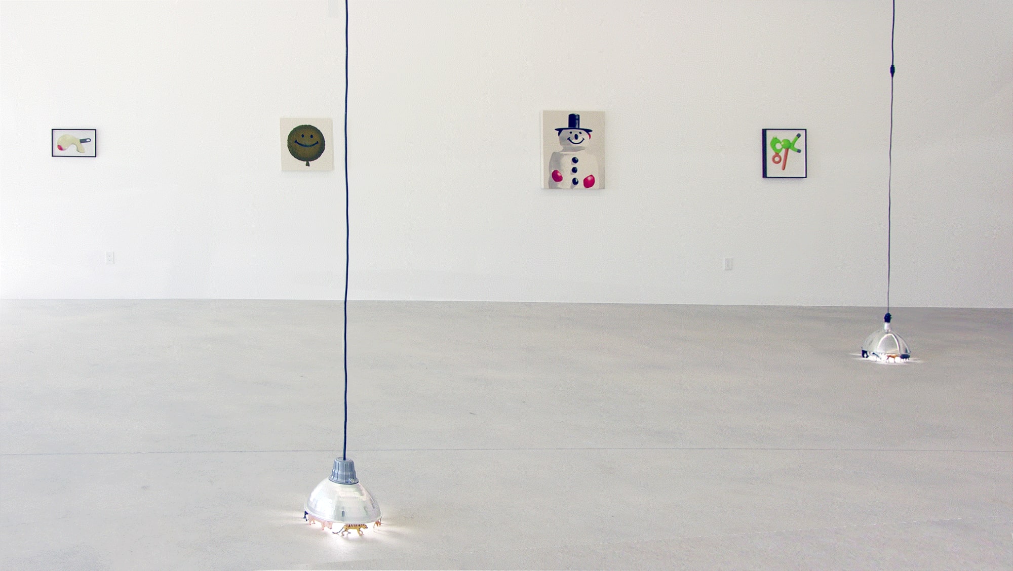 Installation view of Murmur, three works on the wall and a lamp sculpture on the front end.