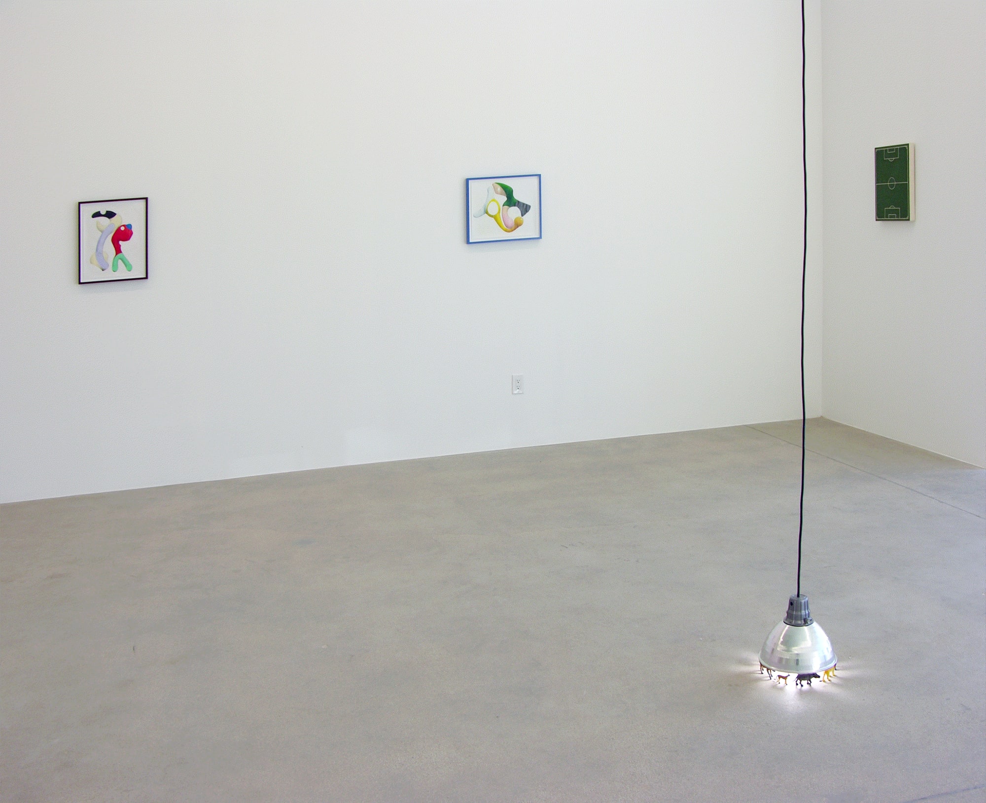 Installation view of Murmur, three works on the wall and a lamp sculpture on the front end.