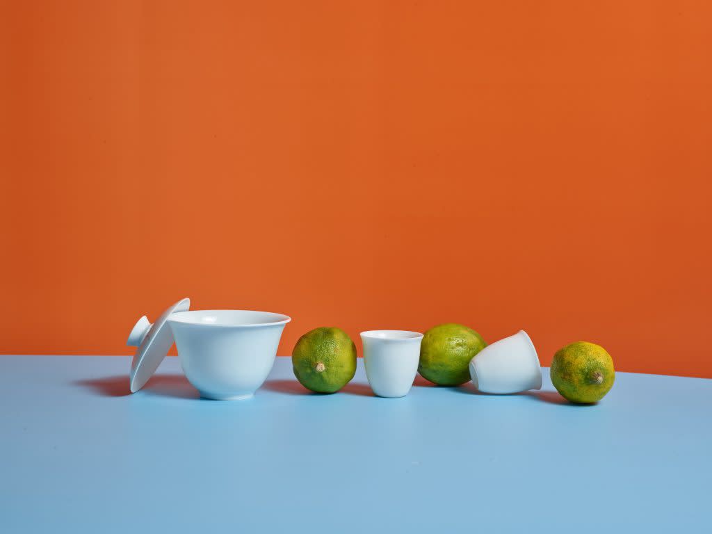 limes with orange and blue background.