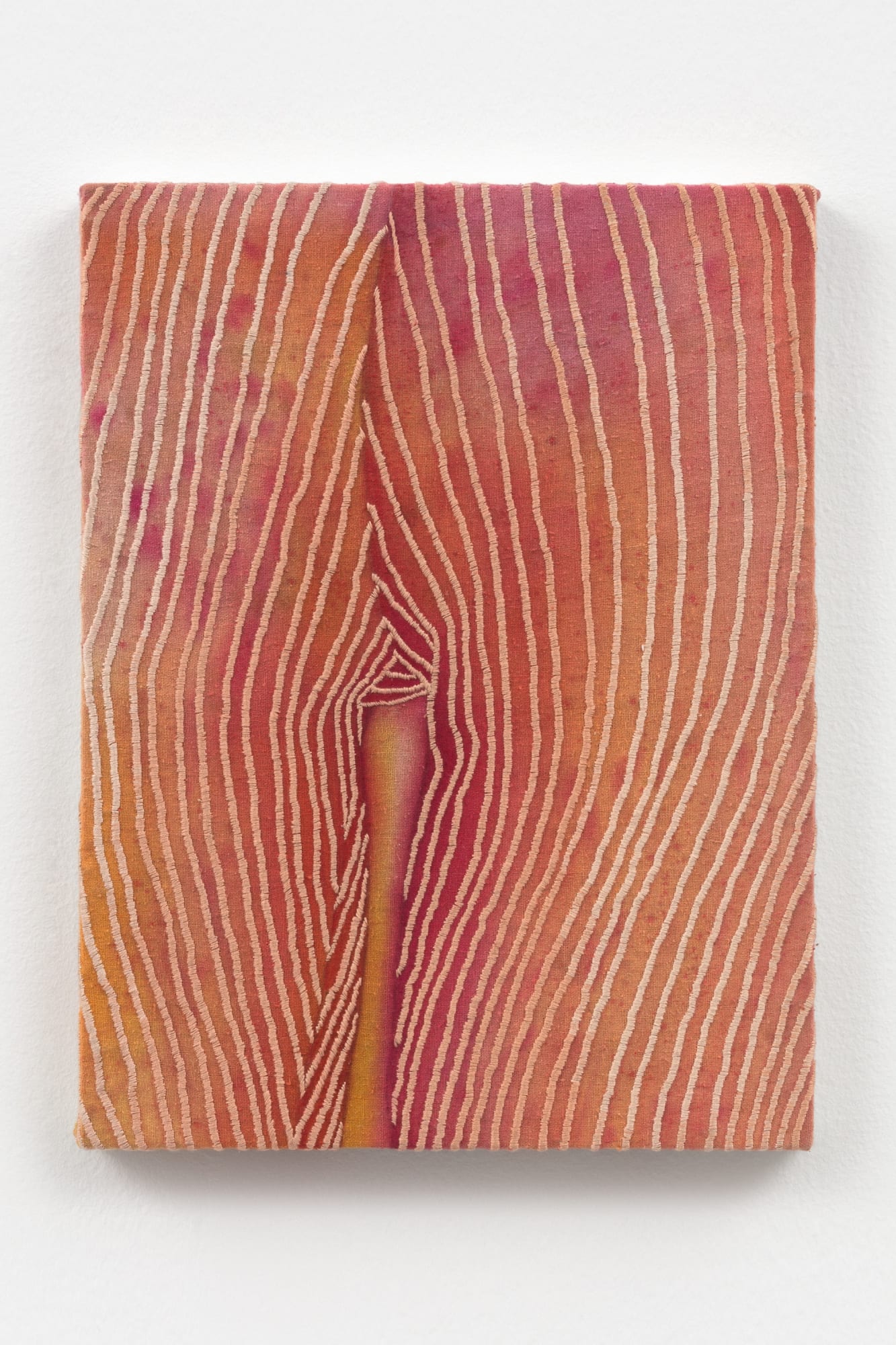 Embroidery on canvas with dye stains splattered across the surface. Embroidery creates a neatly organized composition with its color and thread density located near the centre of the work.