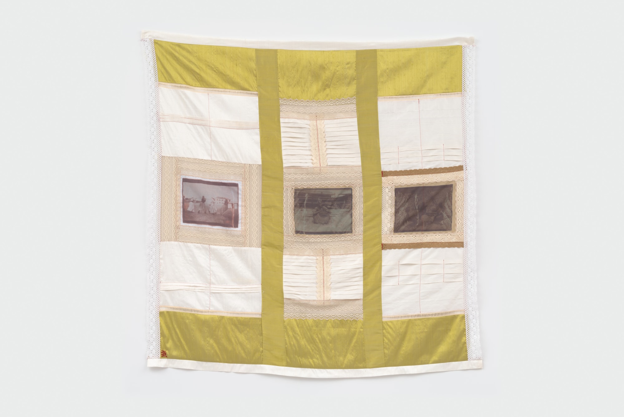 Handmade tapestry with colorful fabric. This work depicts archival image transfer from South Namibian archival images.