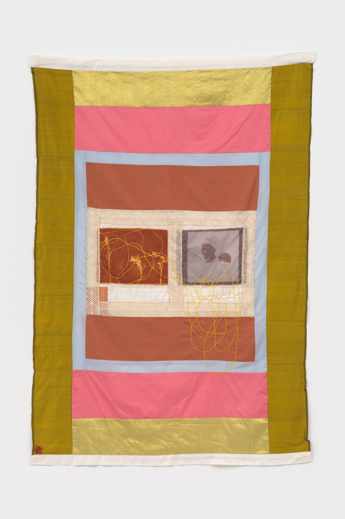 Handmade tapestry with colorful fabric. This work depicts archival image transfer from South Namibian archival images.