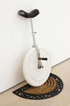 Richard Slee, Unicycle, 2011, Unicycle parts with wood board, plaster, found doormat, and road-marking paint, 103 x 74 x 44.5 cm, 40 1/2 x 29 1/8 x 17 1/2 in