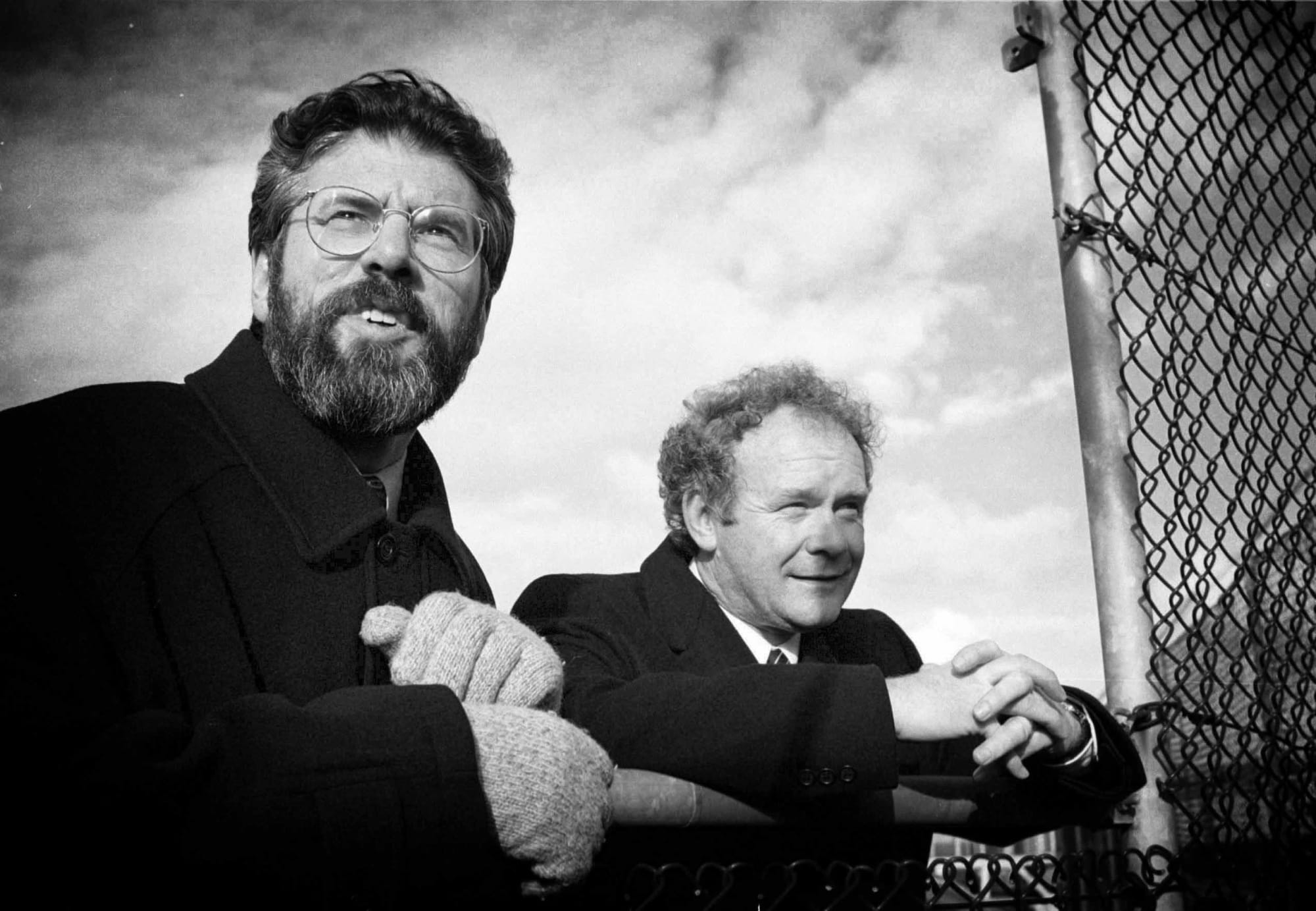 Good Friday/Belfast Historic Agreement. L TO R. Sinn Fein President Gerry Adams and Chief Negotiator Martin McGuinness, look over the wire in Stormont Castle at lunch time, after indicating their final approval of the Good Friday (Belfast Agreement) peace agreement. 10/4/1998 Photo: &copy; Eamonn Farrell