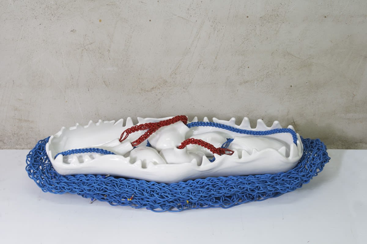 La Madre Devorada / The Devoured Mother, 2020, Glazed ceramic, braided electrical wire, 28” x 11” x 8"