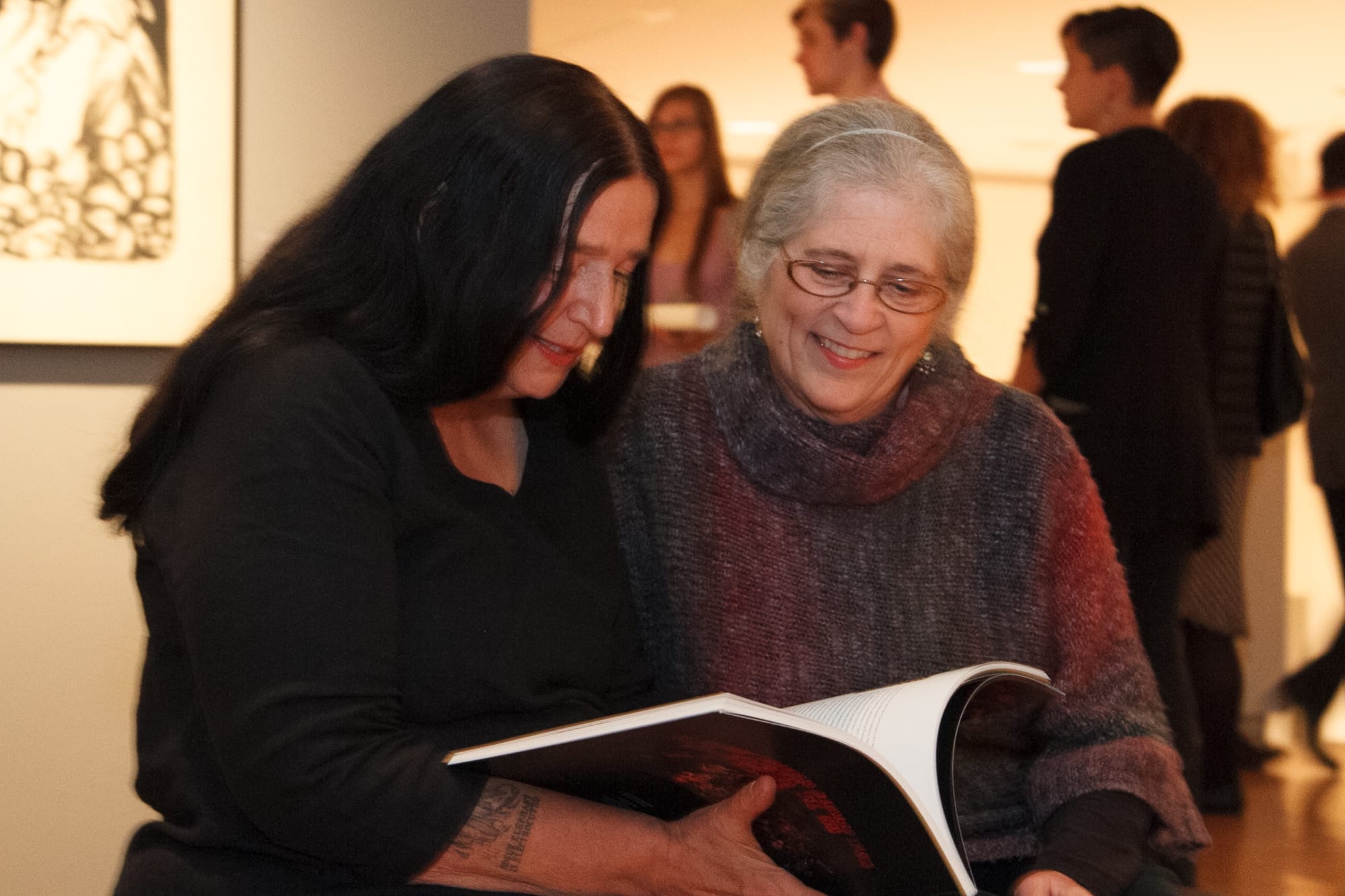 The artist and a fan at the opening of Coe's exhibition "Ghosts of Our Meat," at the Trout Gallery, Dickinson College, 2013–2014