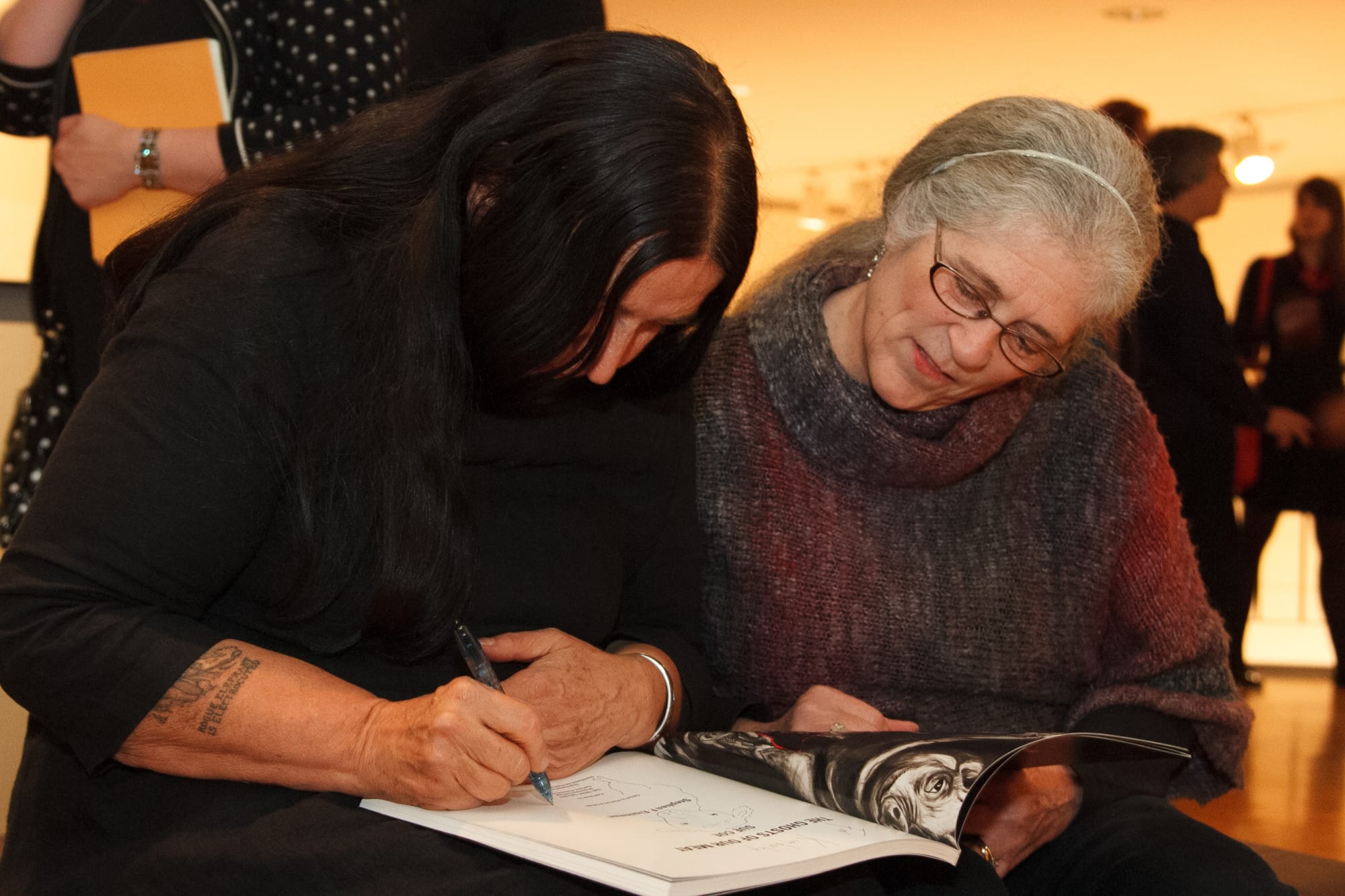 The artist and a fan at the opening of Coe's exhibition "Ghosts of Our Meat," at the Trout Gallery, Dickinson College, 2013–2014