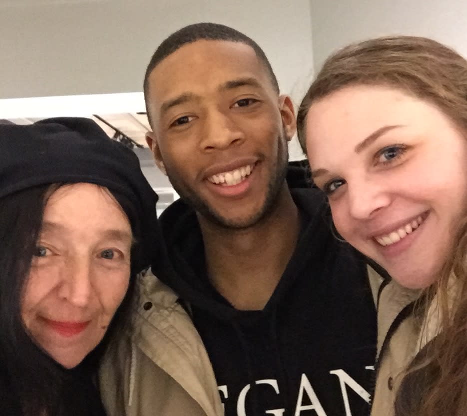 The artist Sue Coe with two students