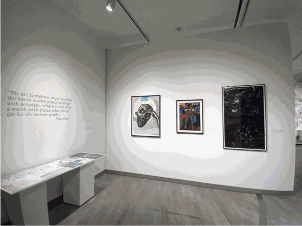 Installation photo of Sue Coe works on the wall of The Artist as Witness exhibition