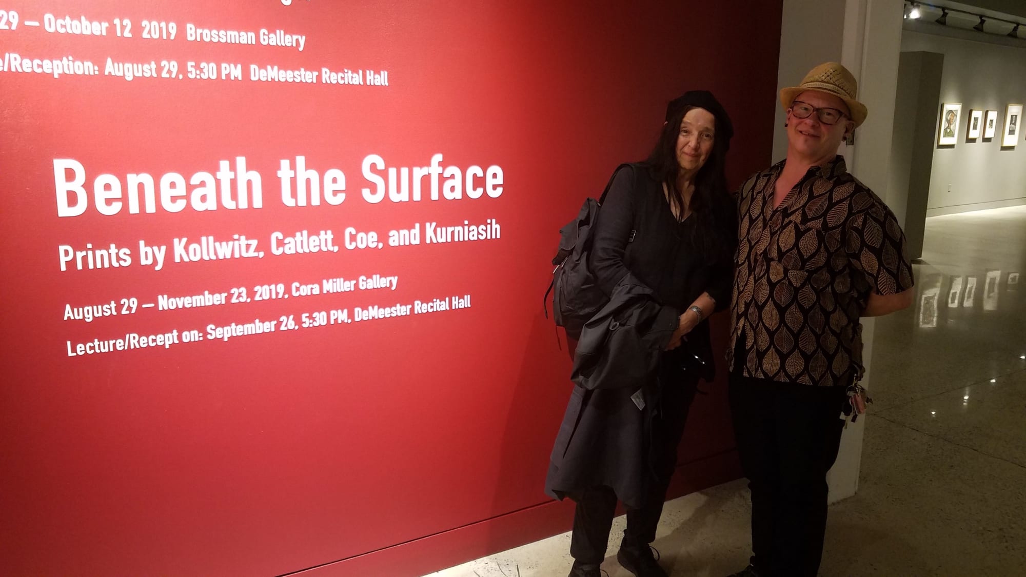 The artist and professor and printmaker Tru Ludwig at the entrance to the exhibition "Beneath the Surface: Prints by Köllwitz, Catlett, Coe, Kurniasih," Cora Miller Gallery, York College of Pennsylvania, 2019