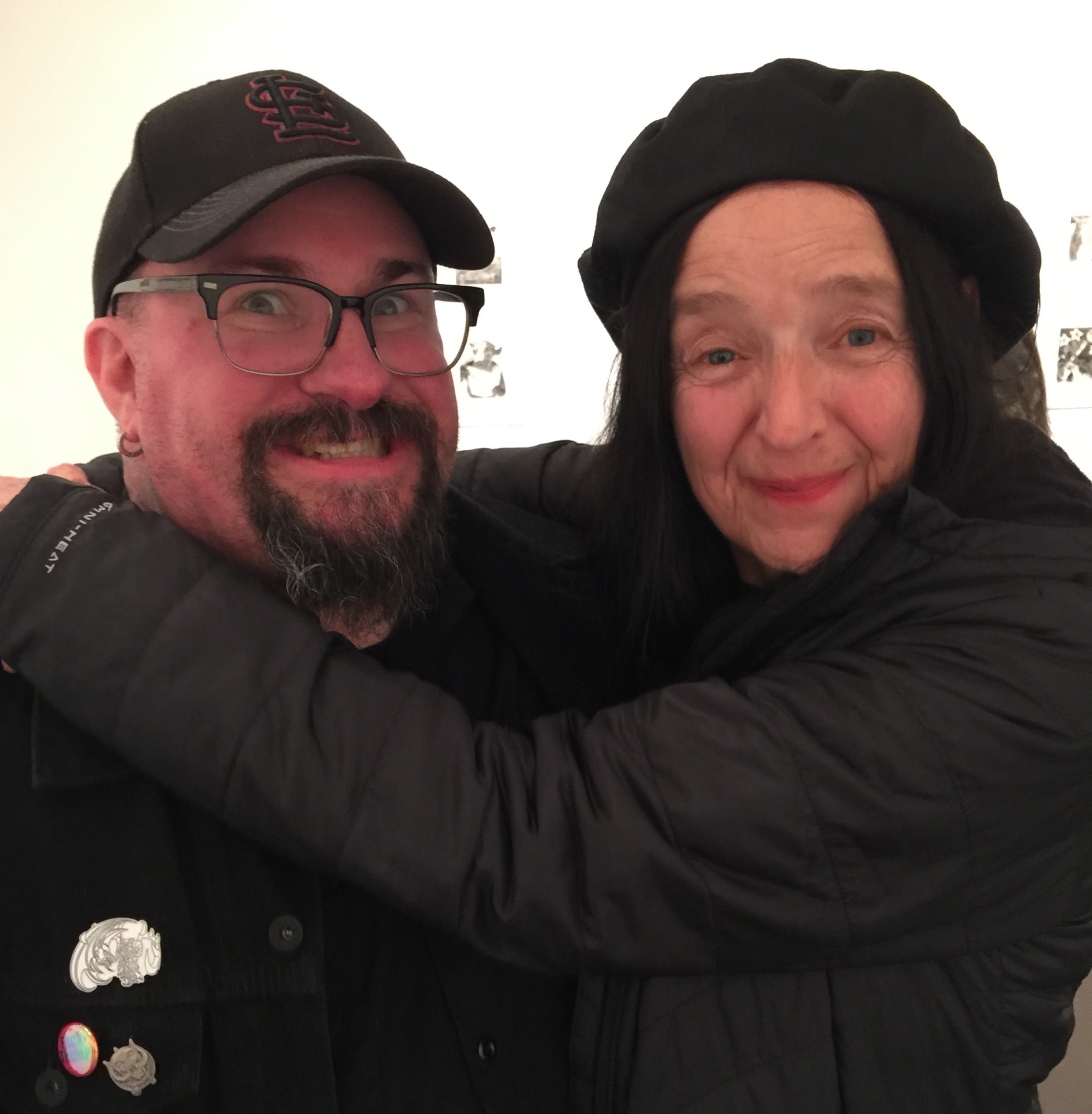 Photograph of the artist hugging fellow printmaker and friend Tom Huck at the SGC International Convention, SGU, Atlanta, GA 2017