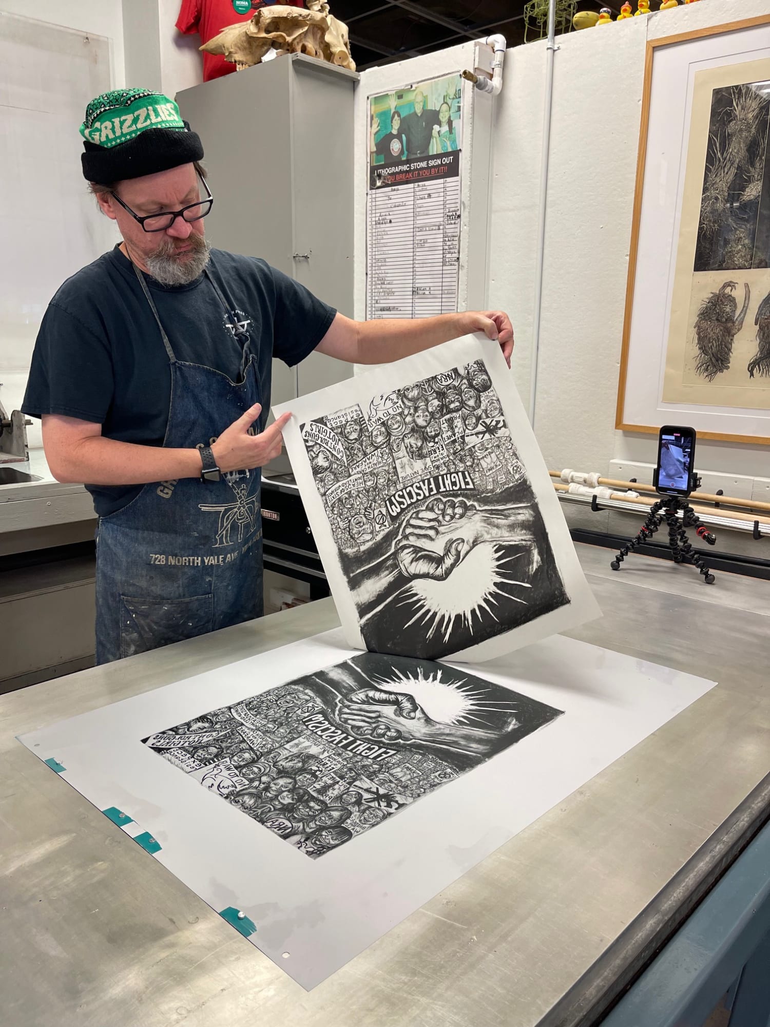 Master Printmaker and Professor Brian Kelly printing a new Coe lithograph during Coe's recent visit to the University of Louisiana, Lafayette, Fall 2024.