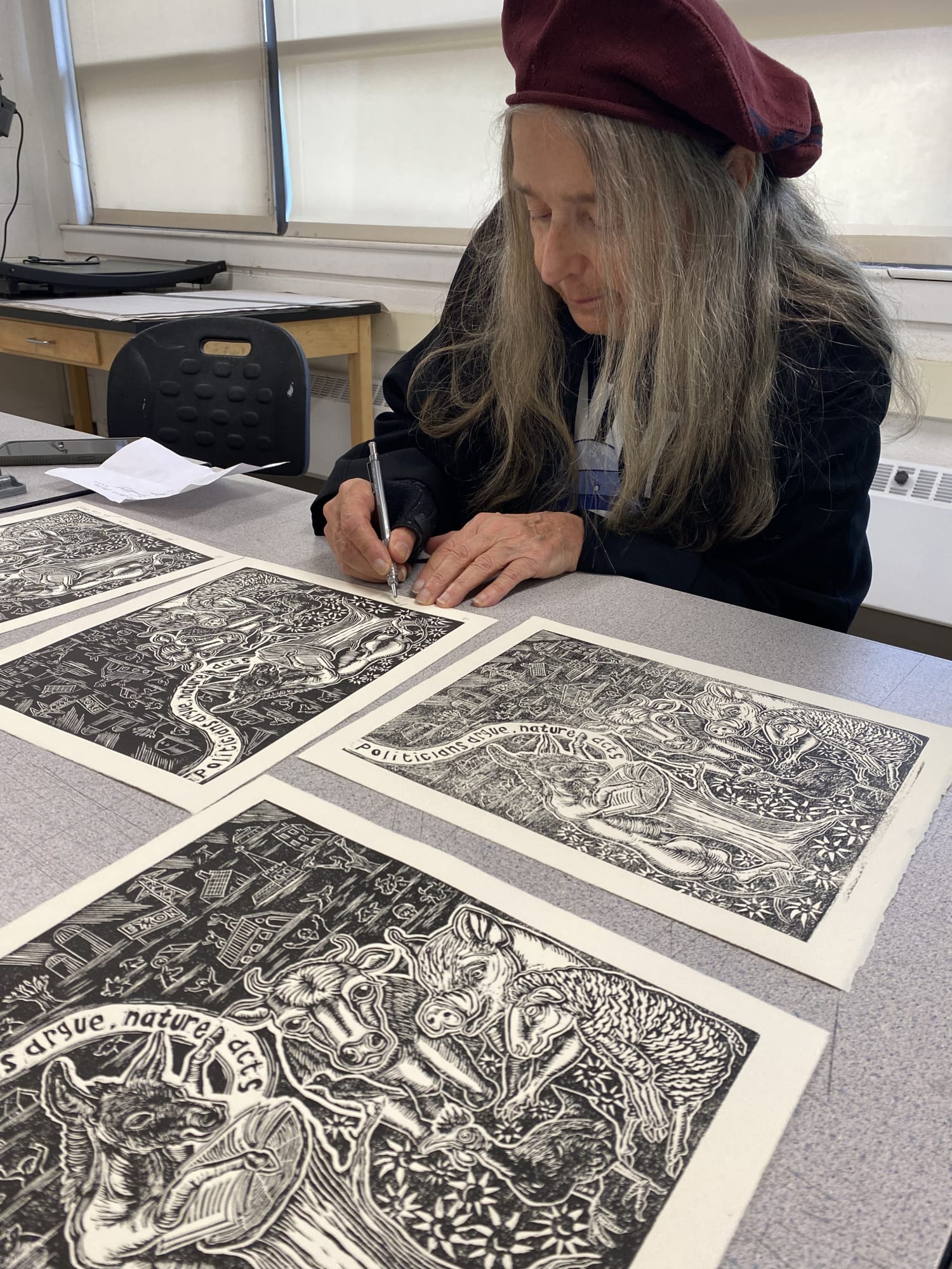 Signing finished prints, Kutztown University, Fall 2023.