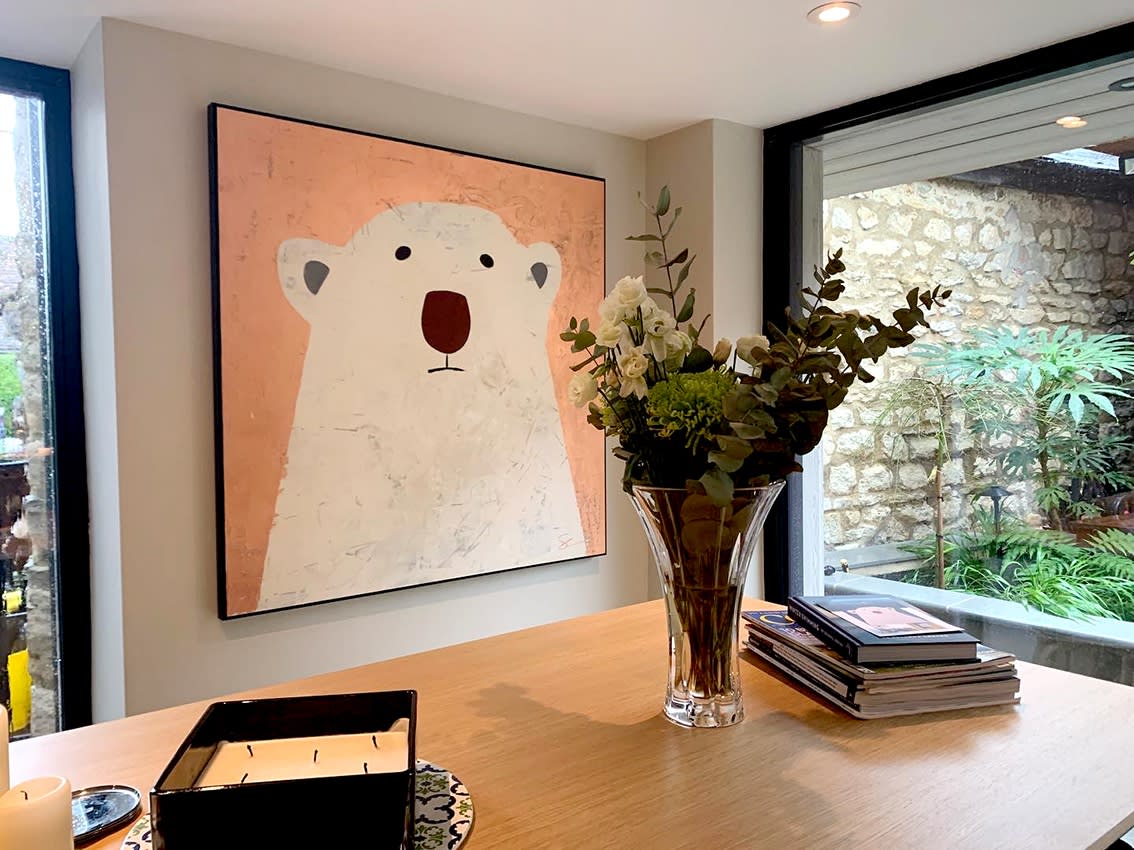 Polar bear with a glass of wine for a nose called Merlo.