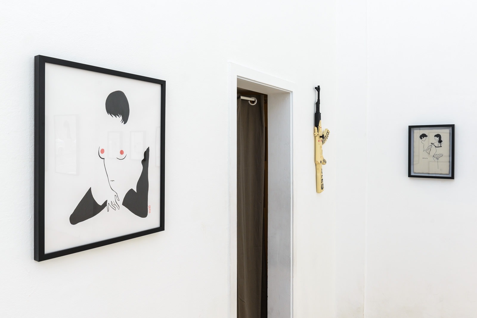 Install photo of framed illustrations by Petite Luxures hung on a wall