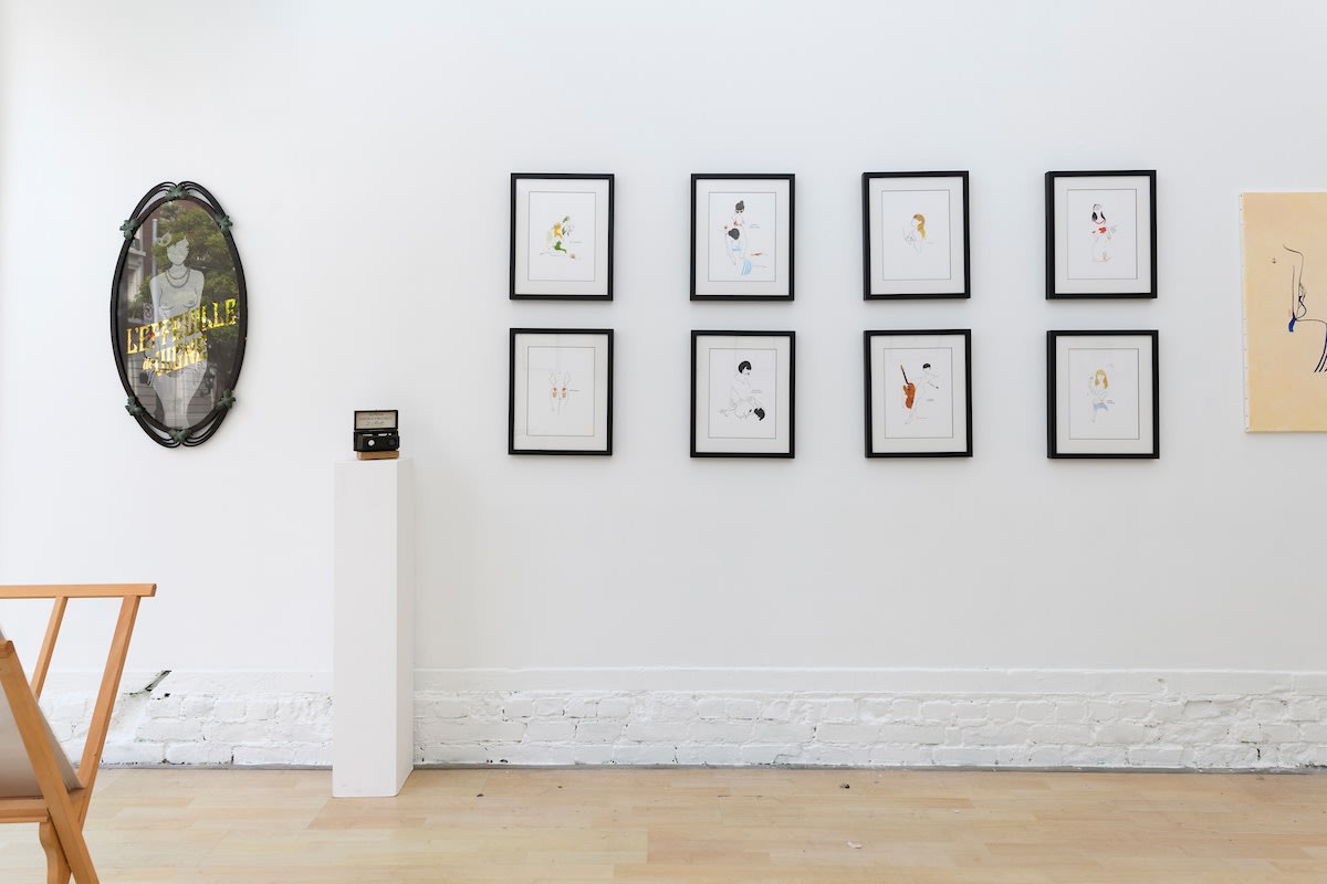 Install photo of framed illustrations by Petite Luxures hung on a wall
