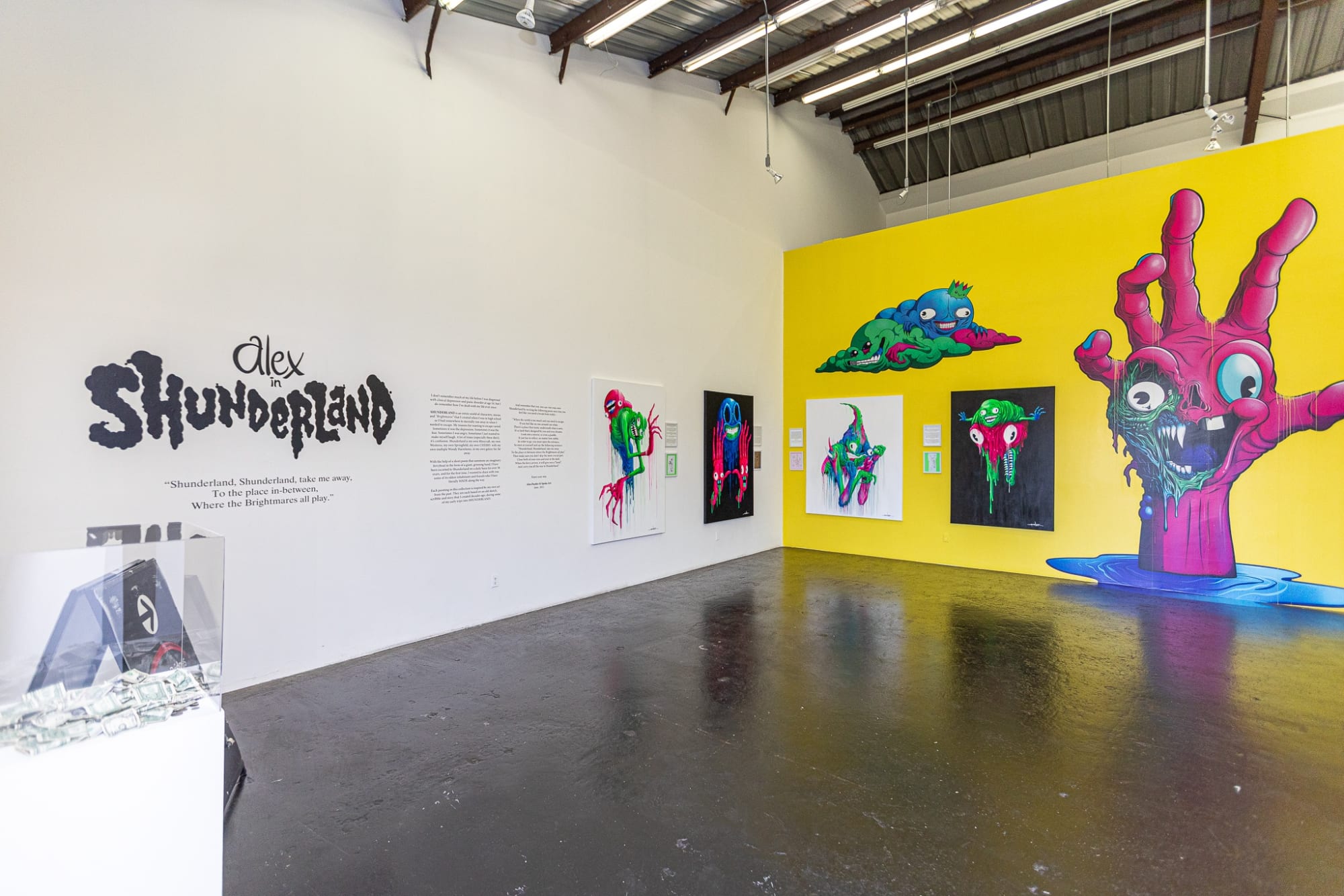Installation shot of colorful Alex Pardee exhibition 