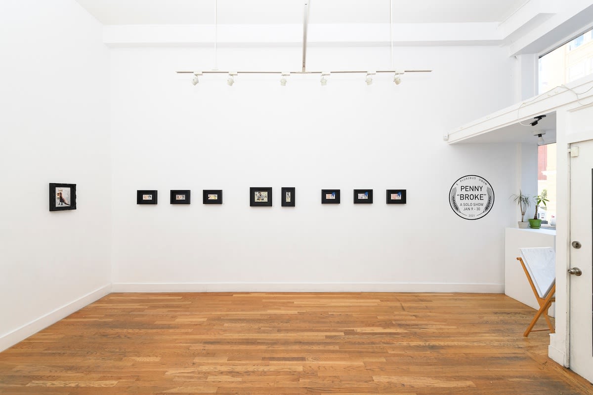 white wall with small framed works by Penny