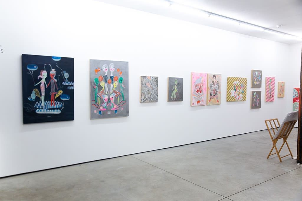 Install shot of white wall with works of various size from Kefe exhibition
