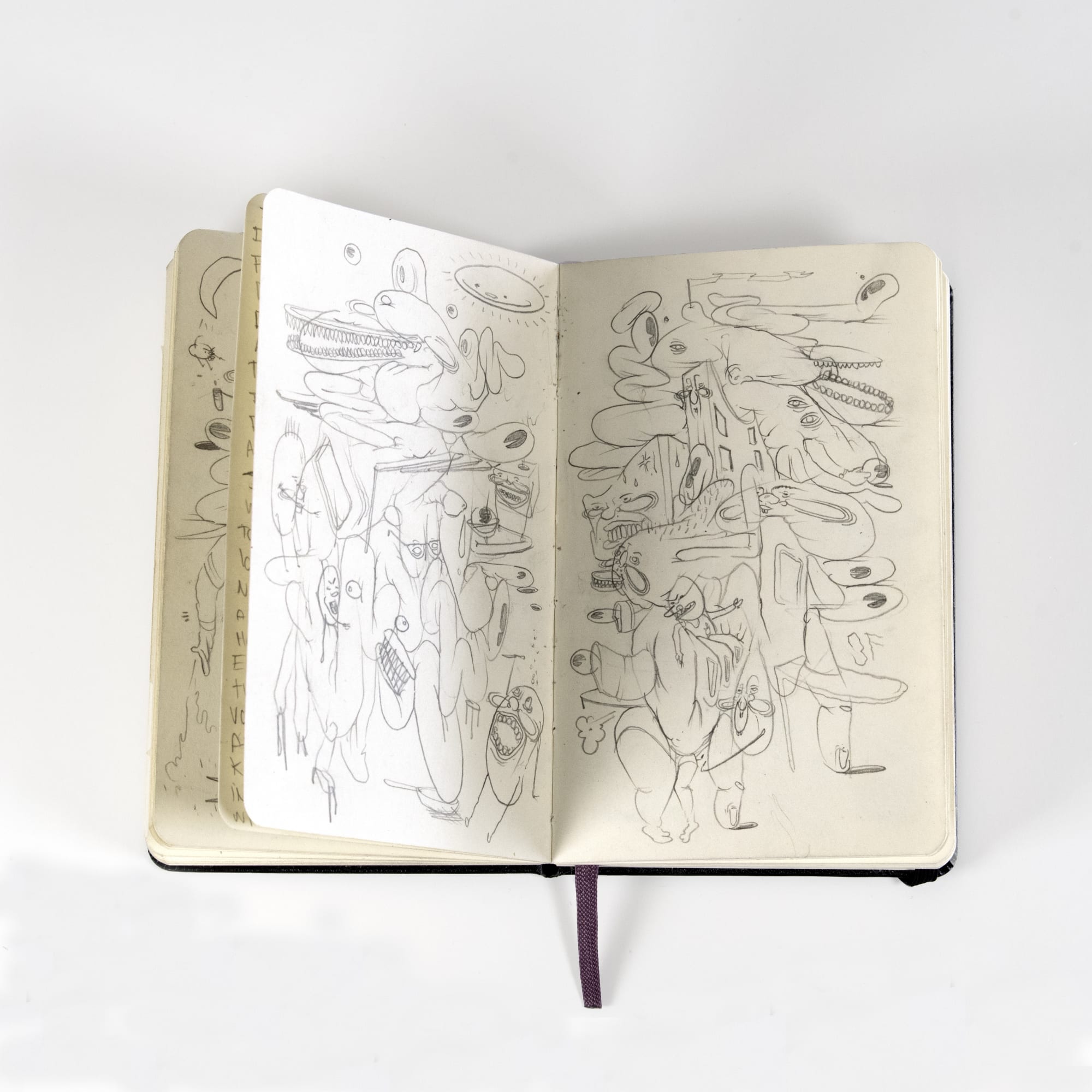 scratchy abstract illustrations inside of a notebook