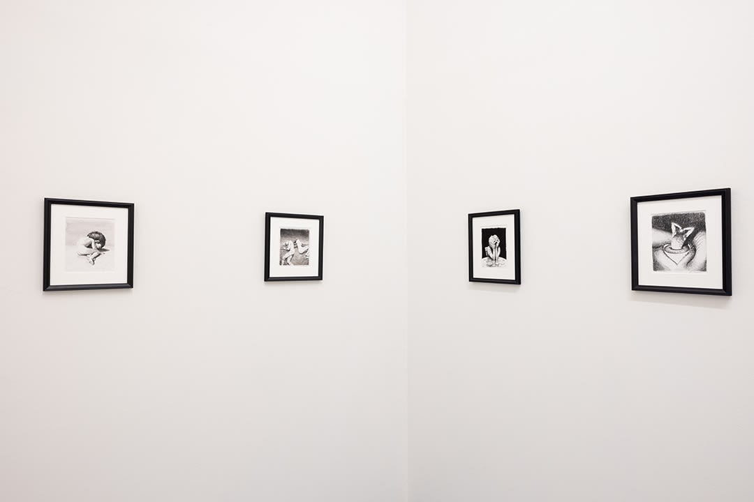 installation photo of black and white Miles Johnston drawings 