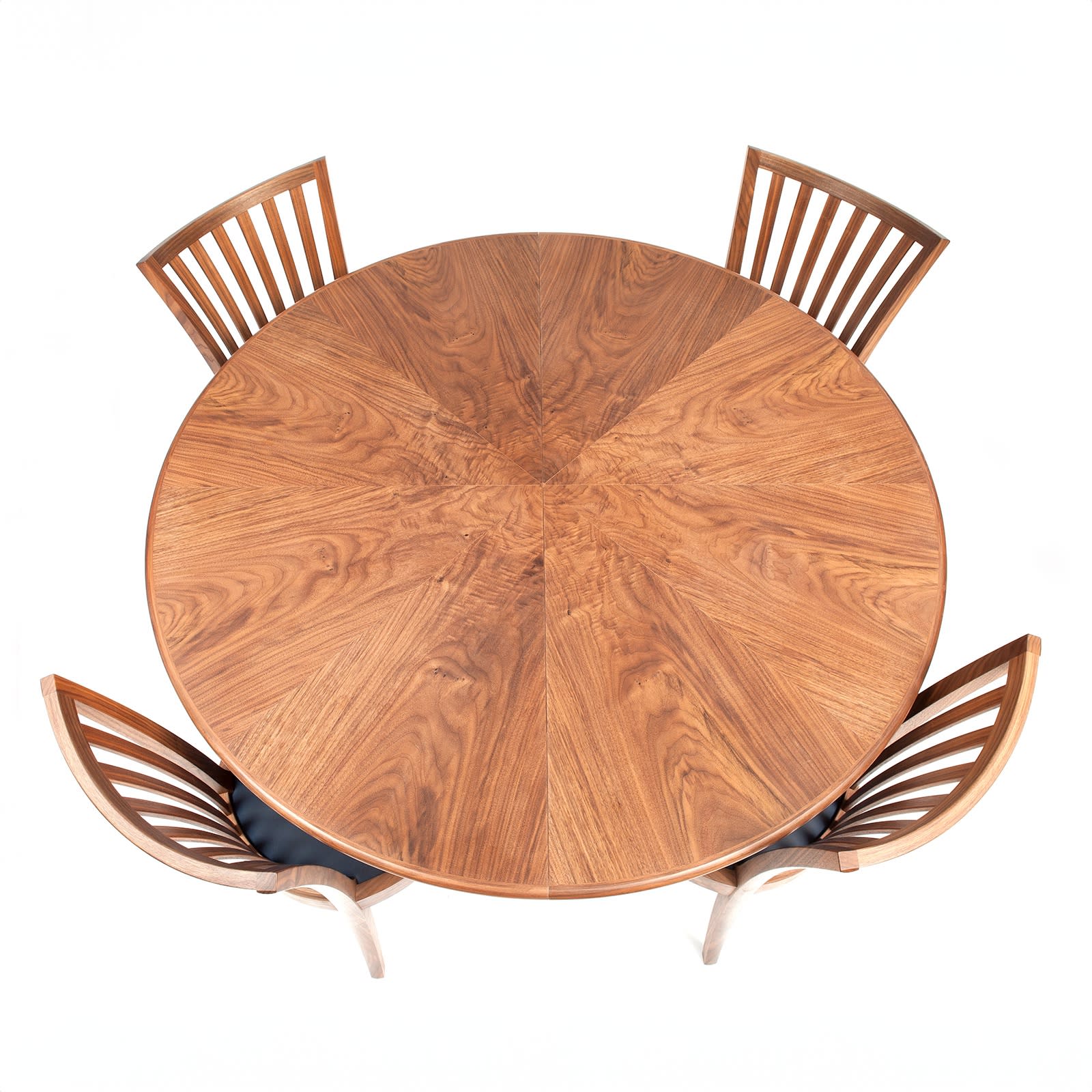 This table-top has a starburst veneer pattern.