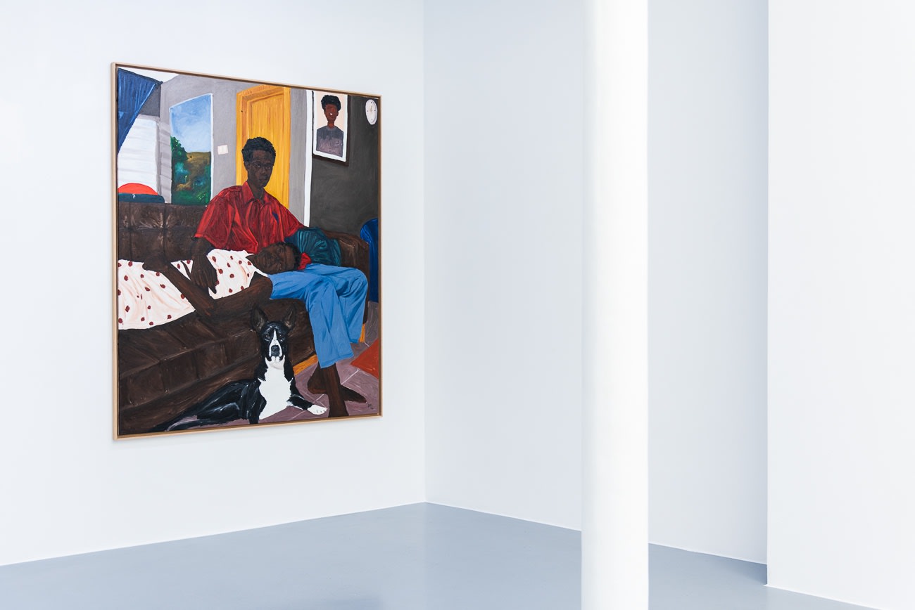A painting on a wall by Matthew Eguavoen, showing a couple on a sofa with a dog. AFIKARIS Gallery. Studio Vanssay.