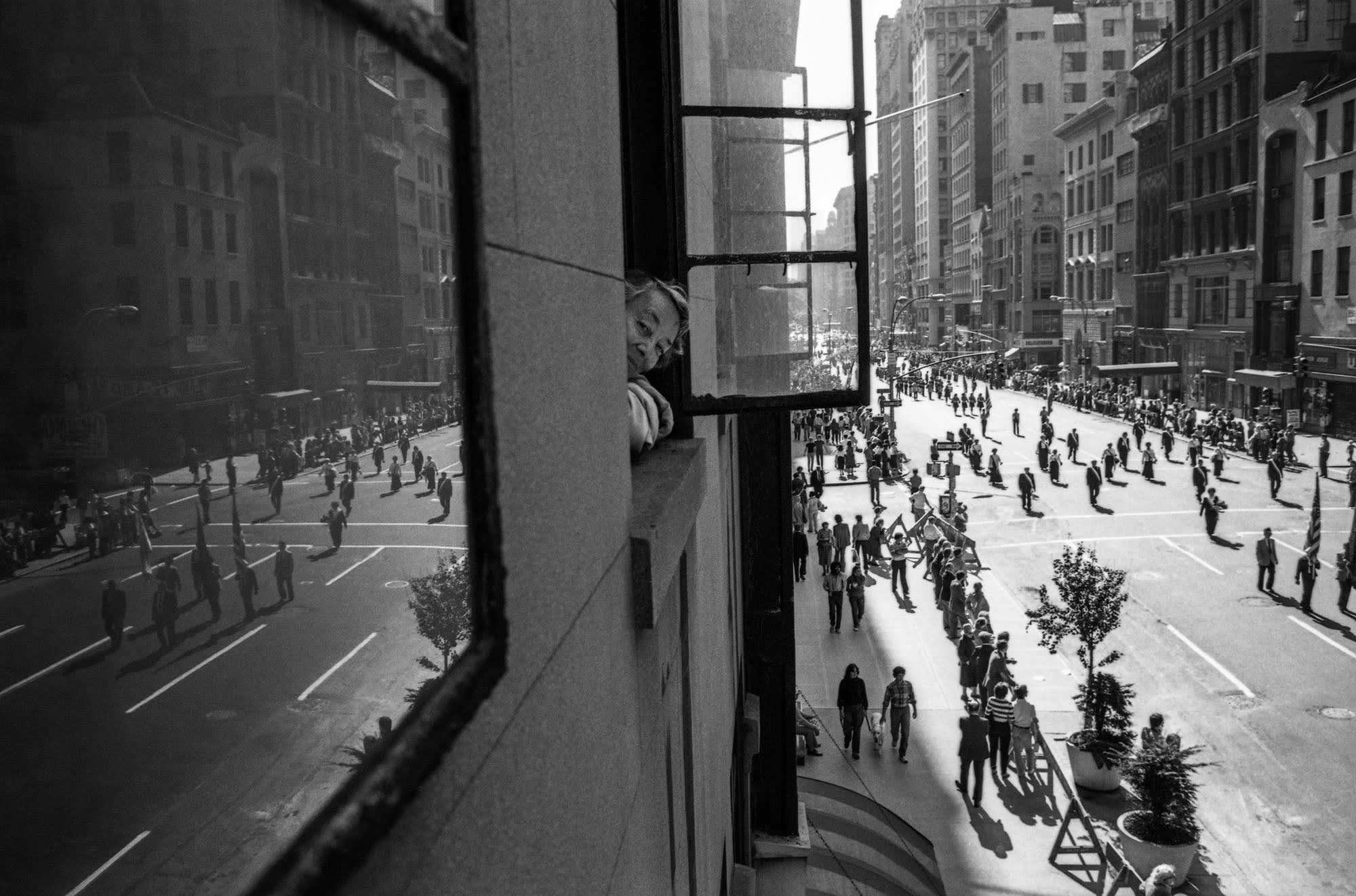 Edie Capa looking out her window, 5th Avenue, NYC, 1982 BAM1982022W01835-21