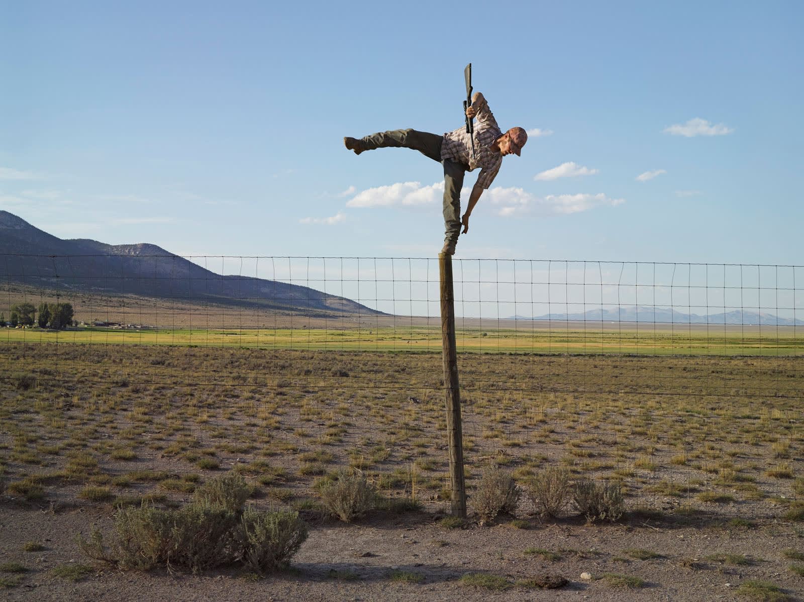 Lucas Foglia, Tommy Trying to Shoot Coyotes, Big Springs Ranch, Oasis, Nevada 2012
